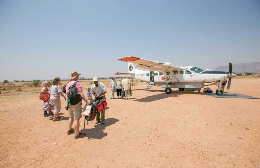 Tourist-Boarding-Coastal-Aviation-Flight-Safarisoko